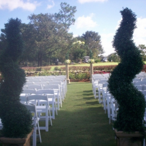 A landscaped property set up with event chairs.
