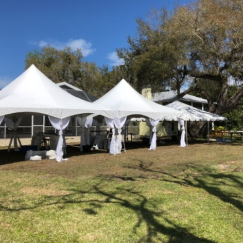 A landscaped property set up with event tents.