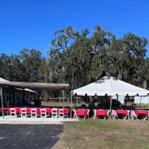 Chairs, tables and tents set up for a wedding venue