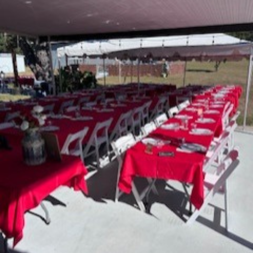Chairs, tables and tents set up for a wedding venue
