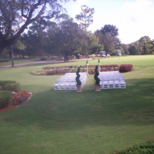 A landscaped property set up with event chairs.