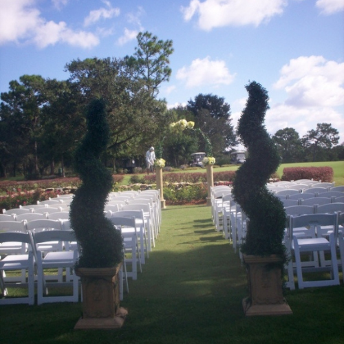 A landscaped property set up with event chairs.
