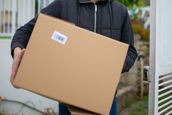A large cardboard box being carried.