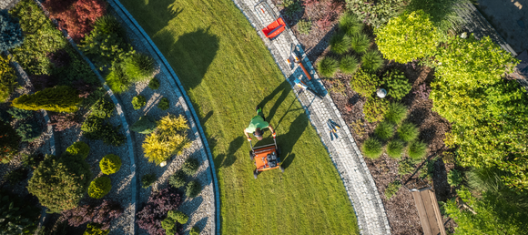 An aerial view of a landscaper working.